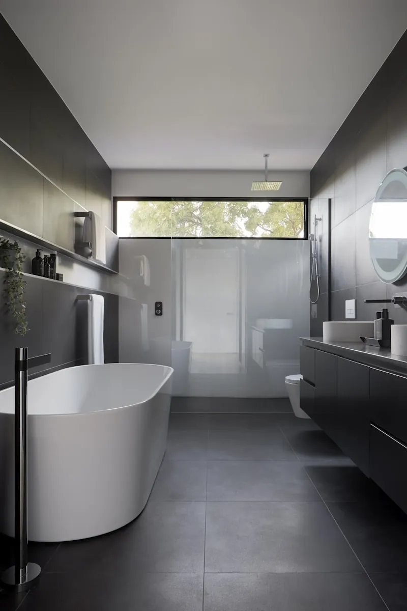 Modern bathroom with bathtub and floor drain area